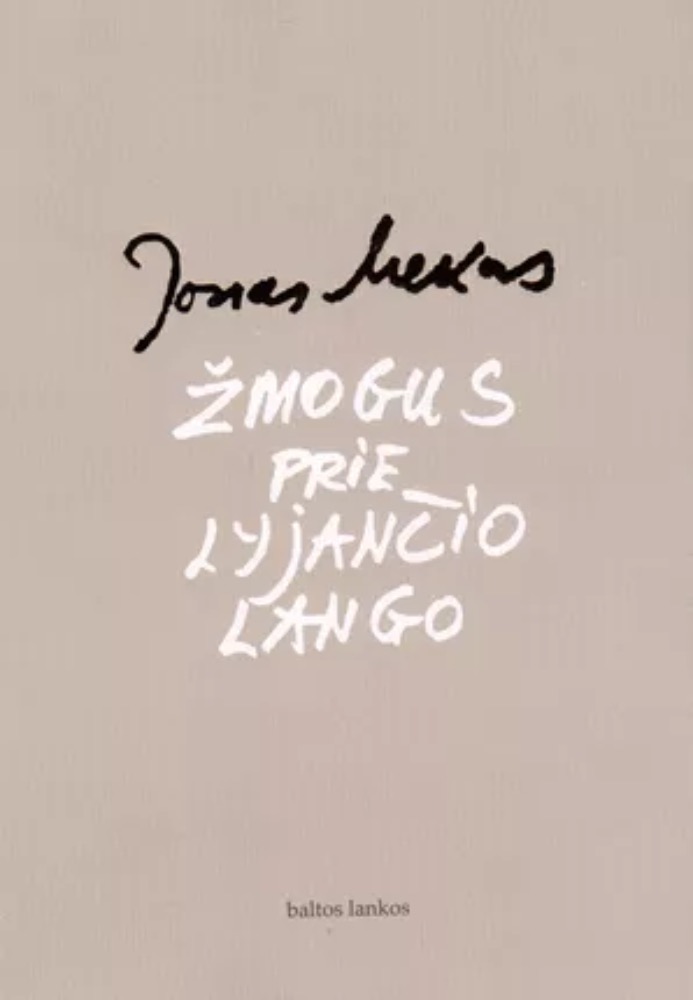 Žmogus prie lyjančio lango